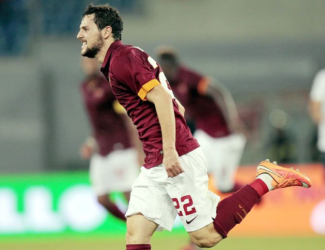Mattia Destro of AS Roma celebrates after scoring against Hellas Verona FC during their Serie A match at Stadio Olimpico on Friday