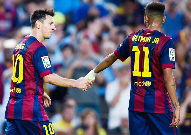 Lionel Messi of FC Barcelona shakes hands with Neymar of FC Barcelona after scoring his team's sixth goal