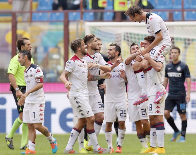 Players of Cagliari celebrate during the Serie A match againt Inter Milan at Stadio Giuseppe Meazza in Milan on Sunday