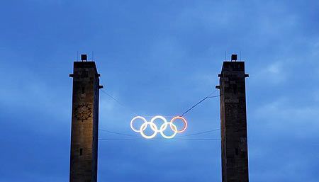 The main entrance of the Olympic stadium is pictured with the illuminated Olympic rings in Berlin