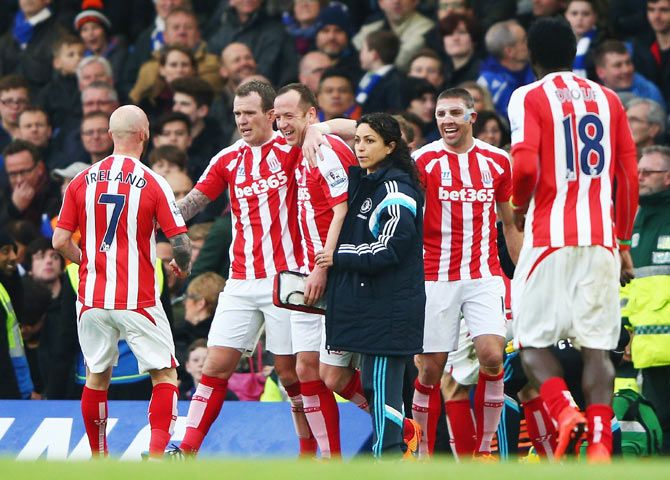Stoke City's Charlie Adam celebrates with teammates after scoring his team's first goal against Chelsea during their Premier League match at Stamford Bridge in London on Saturday