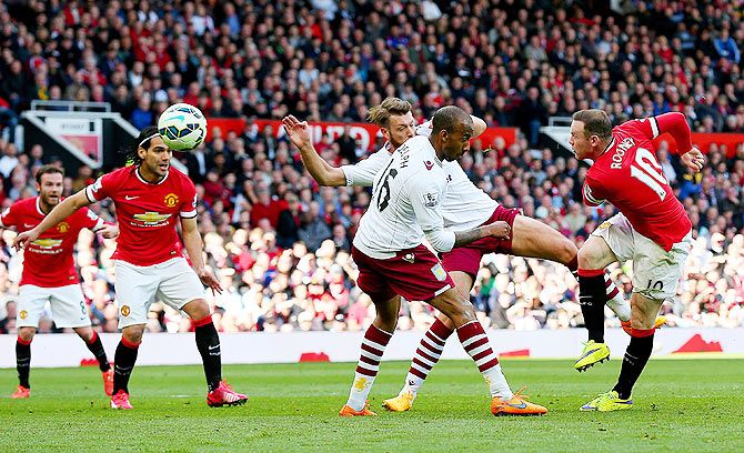 Wayne Rooney of Manchester United scores his team's second goal against Aston Villa during their Premier League match at Old Trafford in Manchester on Saturday