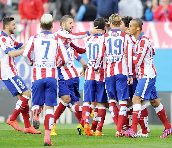 Club Atletico de Madrid players celebrate