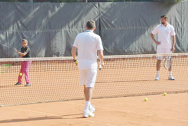 Goran Ivanisevic watches as a kid plays a return during the coaching program on Thursday