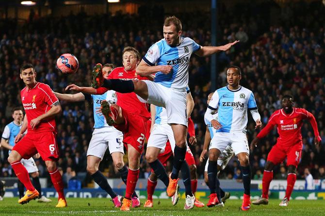 Jordan Rhodes of Blackburn Rovers challenges Lucas Leiva of Liverpool