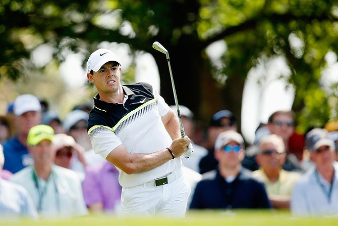 Rory McIlroy of Northern Ireland watches his tee shot on the fourth hole during the first round of the 2015 Masters Tournament at Augusta National Golf Club