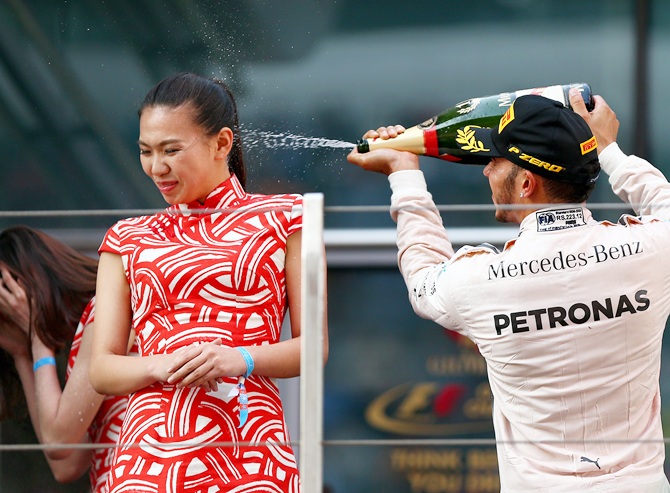 Lewis Hamilton of Great Britain and Mercedes GP celebrates on the podium