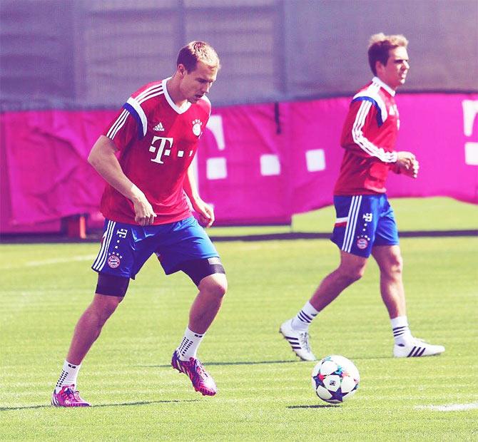 Bayern's Holger Badstuber and Phillip Lahm during a team training session on Monday