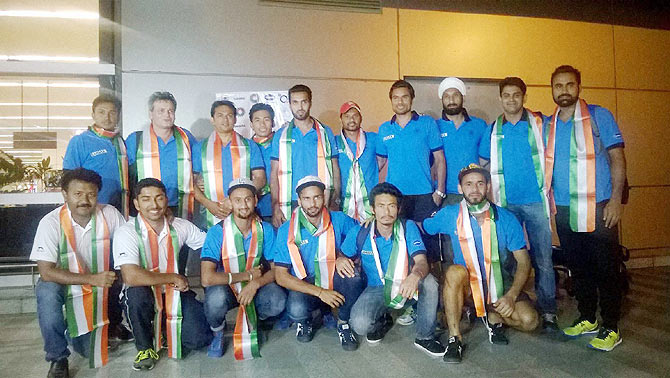 Indian hockey team members arrive at the Indira Gandhi International Airport in New Delhi on Monday after their Bronze Medal win at the 24th Sultan Azlan Shah Cup