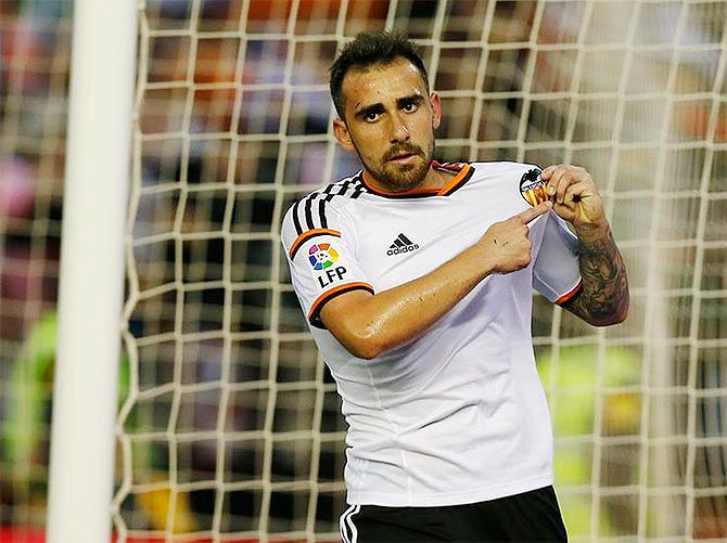 Valencia's Paco Alcacer celebrates on scoring the opening goal against Levante on Monday