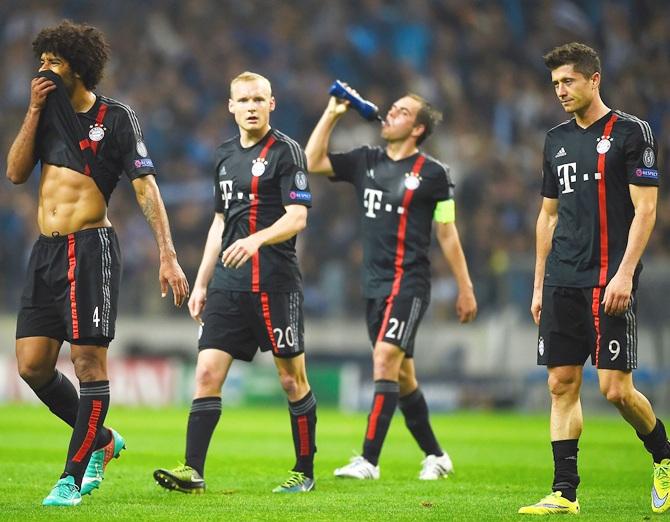 Dante, Sebastian Rode, Philipp Lahm and Robert Lewandowski of Bayern Muenchen 