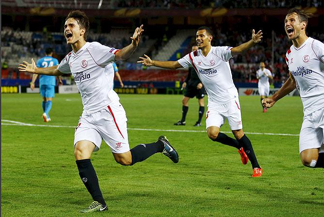 Sevilla's Denis Suarez (left) celebrates with teammates after scoring against Zenit St. Petersburg during their Europa League quarter-final, first leg match at Ramon Sanchez Pizjuan stadium in Seville on Thursday