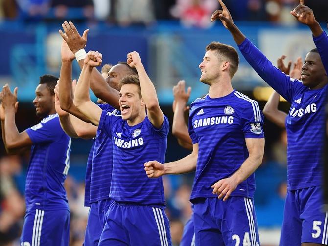 Cesar Azpilicueta, Gary Cahill and Kurt Zouma of Chelsea celebrate