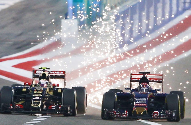 Pastor Maldonado of Lotus (left) and Max Verstappen of Scuderia Toro Rosso in action during the Bahrain Grand Prix on April 19