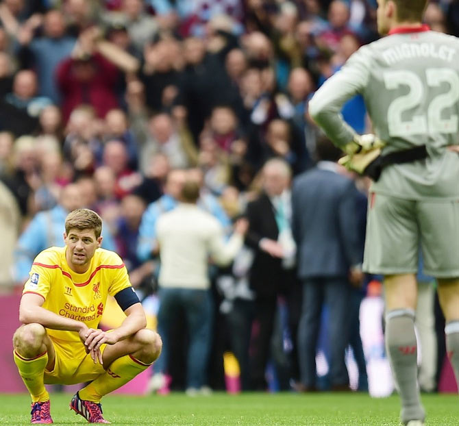 A dejected Steven Gerrard of Liverpool looks on after defeat in the FA Cup semi-final on April 19