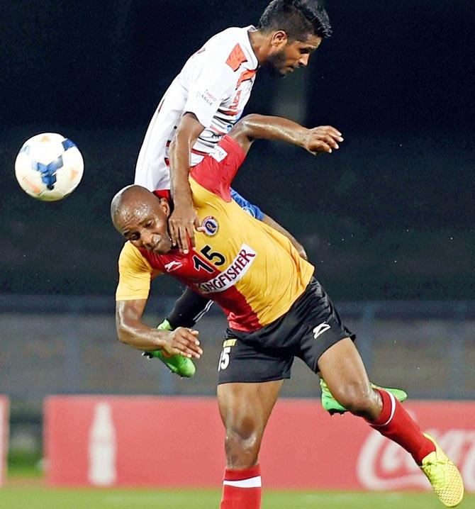 East Bengal striker Machpherlin Omagbemi Dudu vies for the ball with Mumbai FC player Sampath Kuttymani on April 19