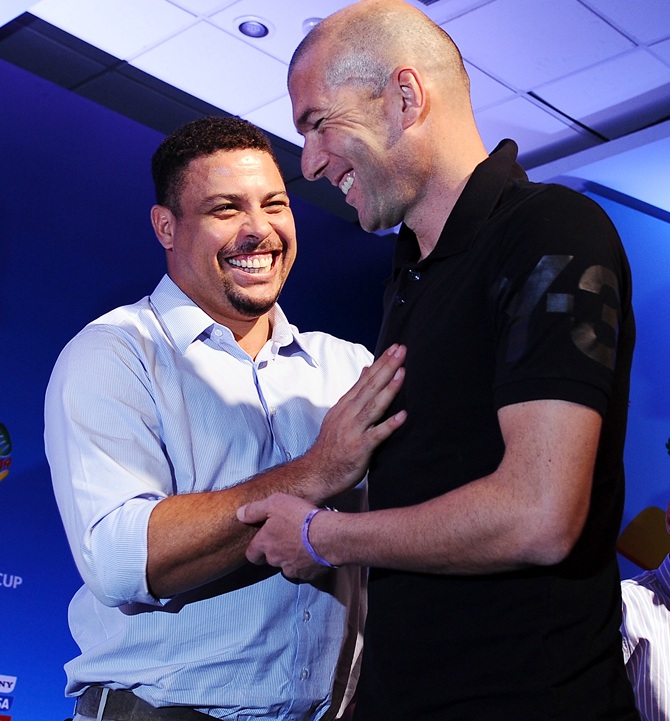 Zinedine Zidane, right, greets Ronaldo