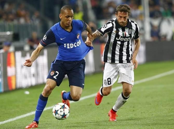 Claudio Marchisio of Juventus battles for possession with Monaco's Fabinho in the UEFA Champions league quarter-final first leg match