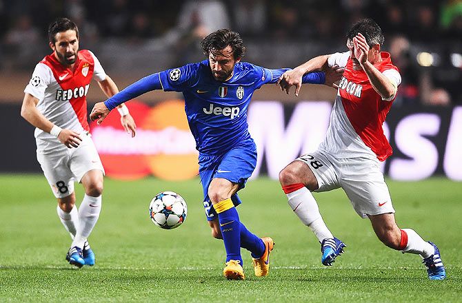 Juventus' Andrea Pirlo is challenged by Monaco's Jeremy Toulalan and Joao Moutinho (left) during their UEFA Champions League quarter-final second leg match at Stade Louis II in Monaco on Wednesday.