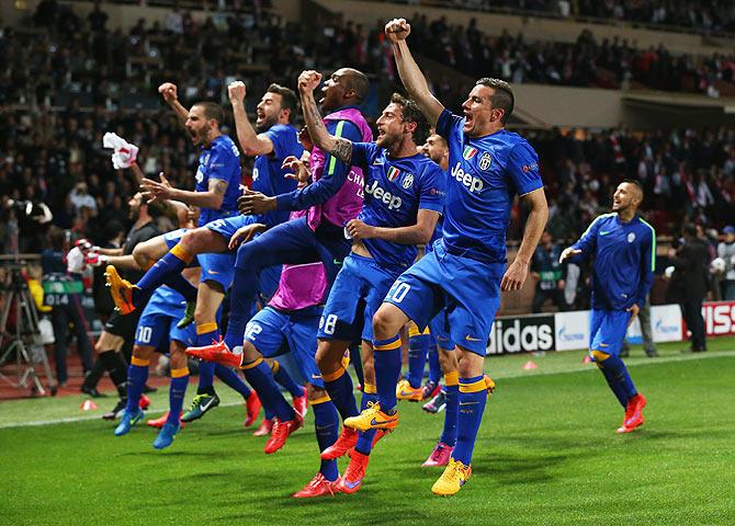 Juventus players celebrate after the UEFA Champions League quarter-final second leg match against Monaco