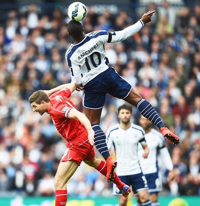   Victor Anichebe of West Brom climbs above Steven Gerrard