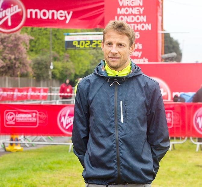 Jenson Button poses for photographs