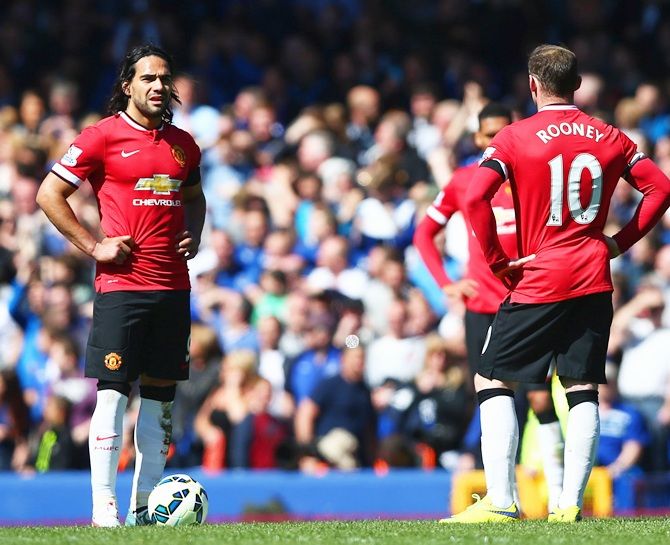 Radamel Falcao Garcia and Wayne Rooney of Manchester United look dejected 