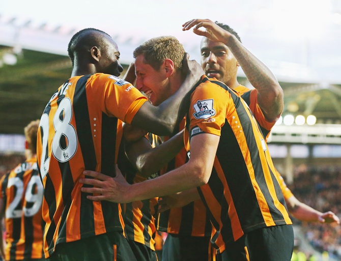 Michael Dawson of Hull City, centre, celebrates