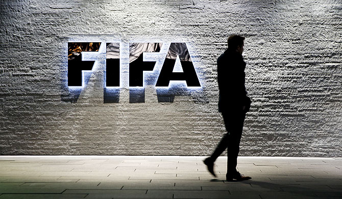  A journalist walks in front of FIFA's headquarters in Zurich, Switzerland on Wednesday