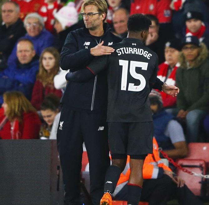 Daniel Sturridge of Liverpool shakes hands with Jurgen Klopp 