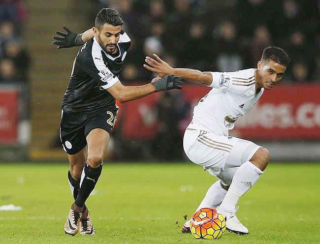 Leicester City's Riyad Mahrez and Swansea City's Kyle Naughton