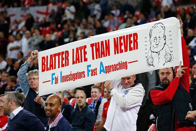 England Fans with banner in reference to FIFA President Sepp Blatter 