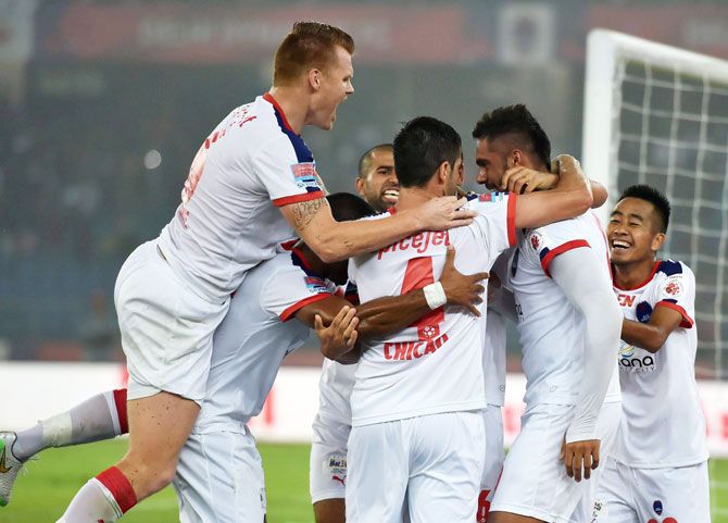 Delhi Dynamos' Robin Singh (2nd from right) celebrates with teammates after scoring against FC Goa during their ISL first leg semi-final match at JawaharLal Nehru Stadium in New Delhi on Friday