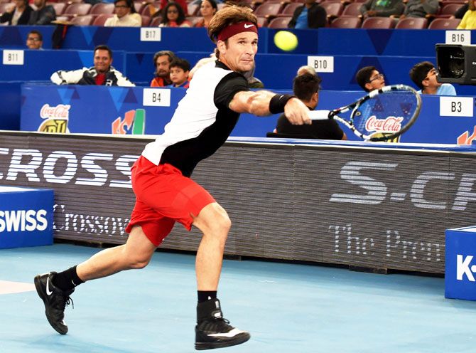 OUE Singapore Slammers' Carlos Moya in action during the International Premier Tennis League (IPTL) match at the IG Stadium in New Delhi on Friday