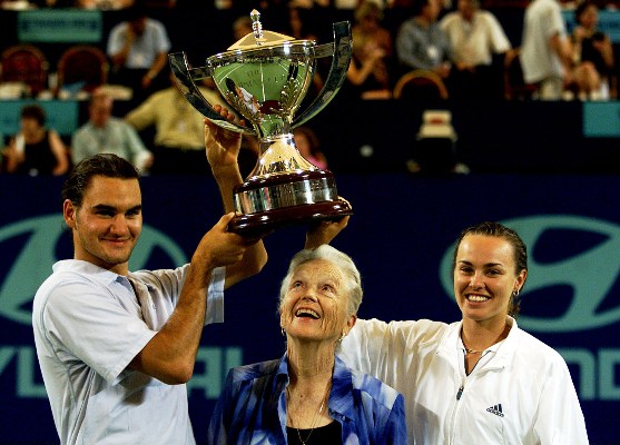 Roger Federer and Martina Hingis of Switzerland hold the Hopman Cup trophy in 2001 