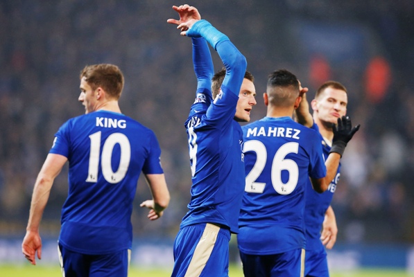 Jamie Vardy celebrates with team mates after scoring the first goal for Leicester 
