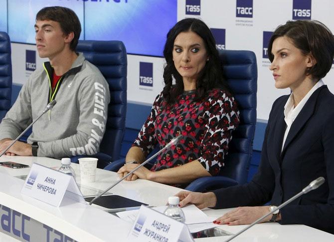 From left, Russian track and field athlete Sergey Shubenkov, pole vaulter Yelena Isinbayeva and high jumper Anna Chicherova attend a news conference in Moscow