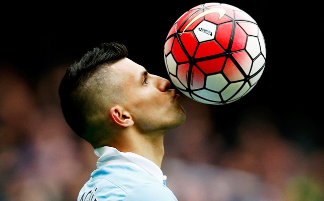 Sergio Aguero of Manchester City kisses the ball to celebrate a goal during a Premier League match 