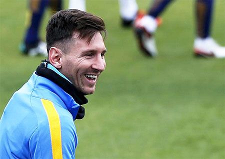 Barcelona's soccer player Lionel Messi smiles during a training session ahead of their Club World Cup semi-final soccer match against Guangzhou Evergrande in Yokohama, south of Tokyo on Tuesday