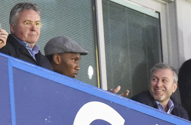 New Chelsea manager Guus Hiddink, former player Didier Drogba and owner Roman Abramovich celebrate after their third goal