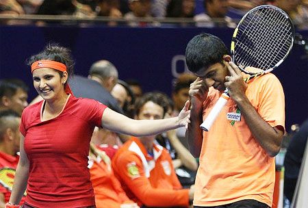 Sania Mirza and Rohan Bopanna celebrate following their mixed-doubles match on Saturday