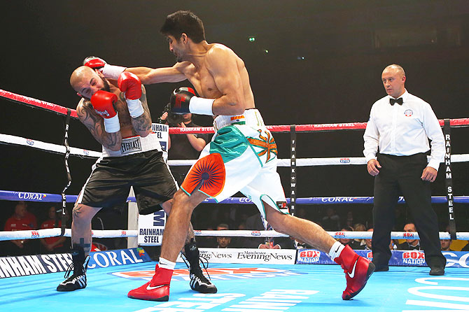 Vijender Singh lands a punch on Samet Hyuseinov during their Middleweight bout at the Manchester Arena on Saturday