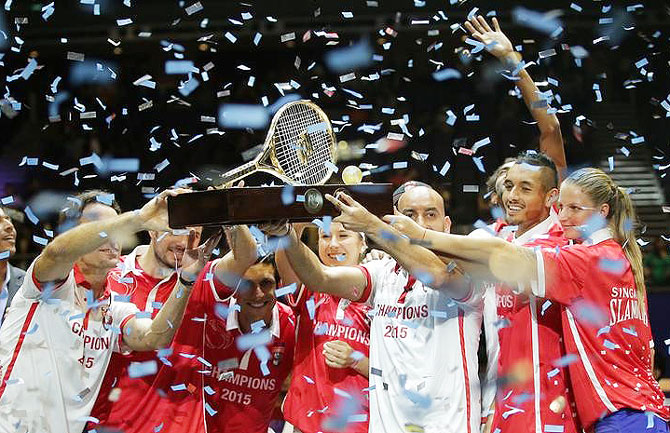 Members of the Singapore Slammers celebrate after winning the IPTL final at the Singapore Indoor Stadium in Singapore on Sunday