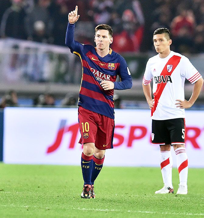 FC Barcelona's Lionel Messi celebrates after scoring the opening goal against River Plate
