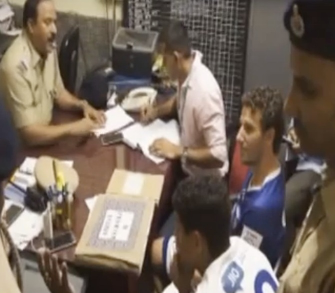 Chennaiyin FC captain Elano Blumer, centre, at the police station after he was arrested for attacking FC Goa co-owner Dattaraj Salgaocar