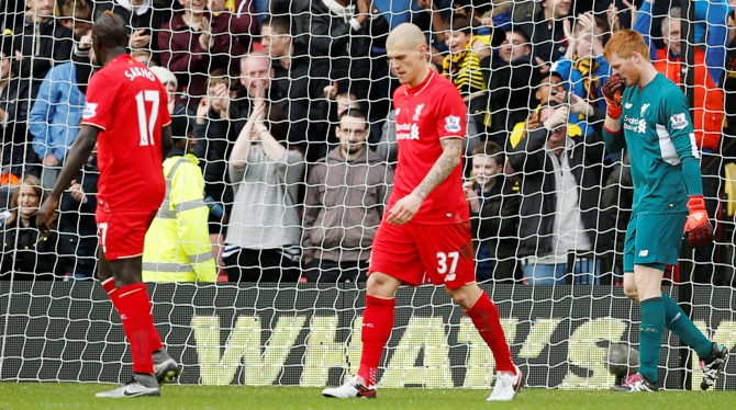 Liverpool's Mamadou Sakho, Martin Skrtel and Adam Bogdan look dejected 