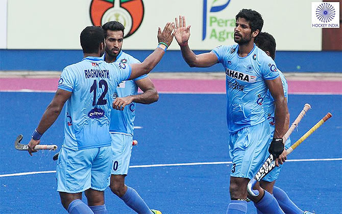India hockey players celebrate a goal