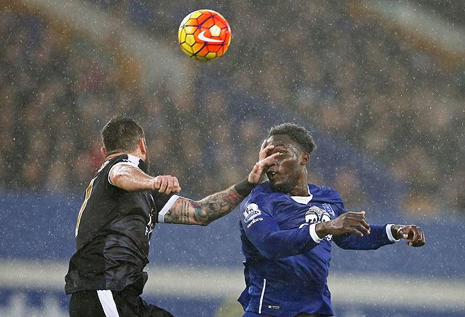 Everton's Romelu Lukaku and Leicester's Marcin Wasilewski vie for possession during their English Premier League match at Goodison Park on Saturday