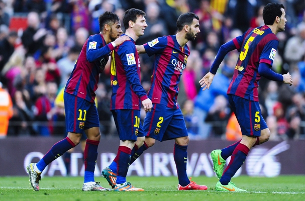 Lionel Messi (second left) of FC Barcelona celebrates with his teammates after scoring 