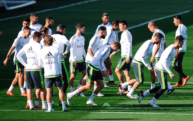 Real Madrid players warm-up during the team training session 